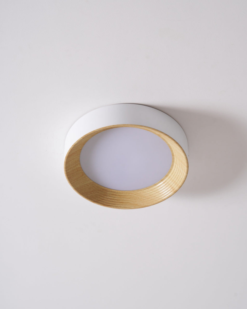 Wood-tone ceiling light with bright acrylic diffuser