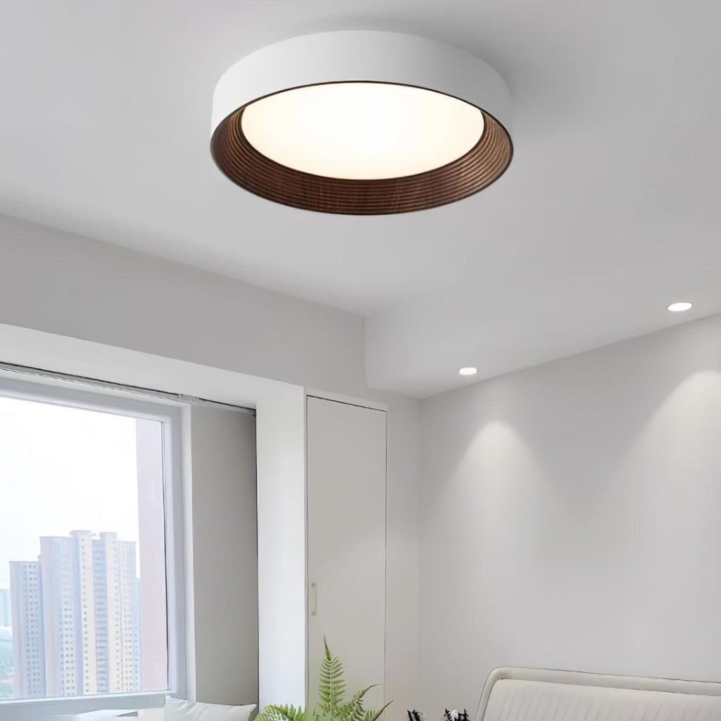 Wood-tone ceiling light viewed from below when lit