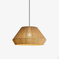 Product view of this Clérachic pendant, showing the folded facet line partway down its wide linen drum shade.