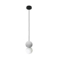 This Clérachic pendant, a grey stone-textured sphere above an opal glass globe, hangs from a black ceiling canopy on white.