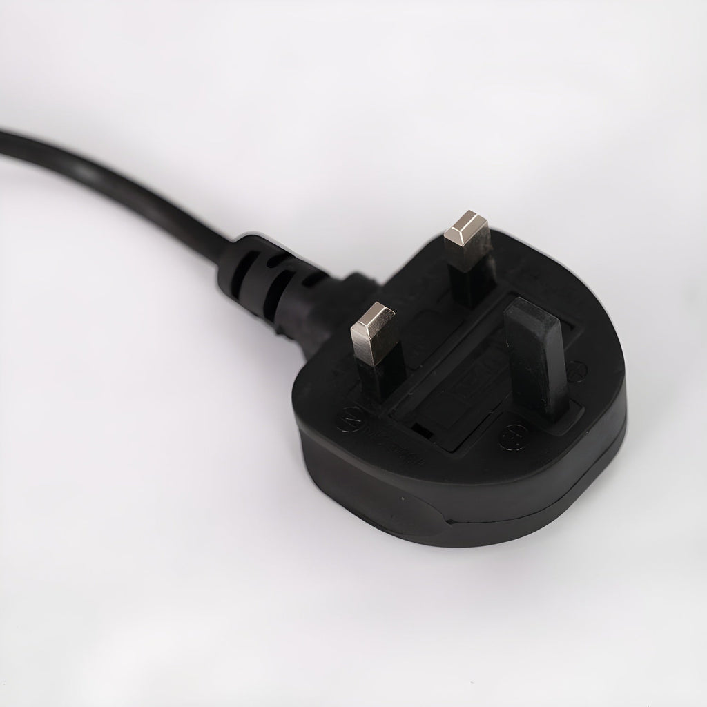 Close-up of the UK three-pin plug fitted to the end of a Clérachic arc floor lamp's power cord.