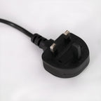 Close-up of the UK three-pin plug fitted to the end of a Clérachic arc floor lamp's power cord.