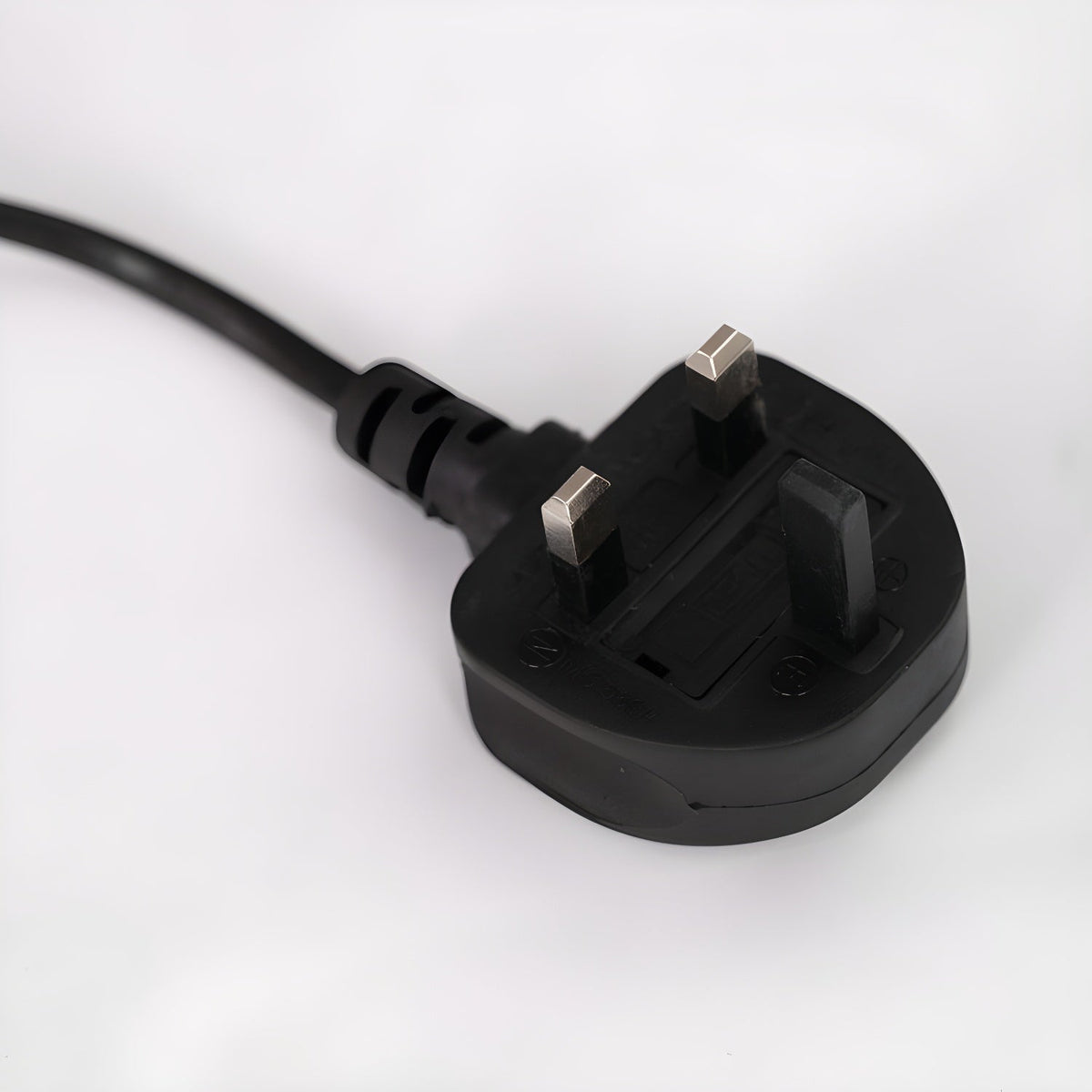 Close-up of the UK three-pin plug fitted to the end of a Clérachic arc floor lamp's power cord.