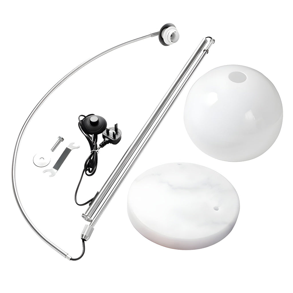 Unassembled parts of a Clérachic arc floor lamp: the nickel arc, two dome shades, marble base and foot switch.