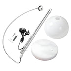 Unassembled parts of a Clérachic arc floor lamp: the nickel arc, two dome shades, marble base and foot switch.