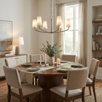 Above a round dining table set with candles, this Clérachic chandelier's curved arms weave together in matte black.