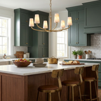 Over a wood kitchen island in a green-cabinetry kitchen, this Clérachic chandelier's six arms glow in brushed brass.