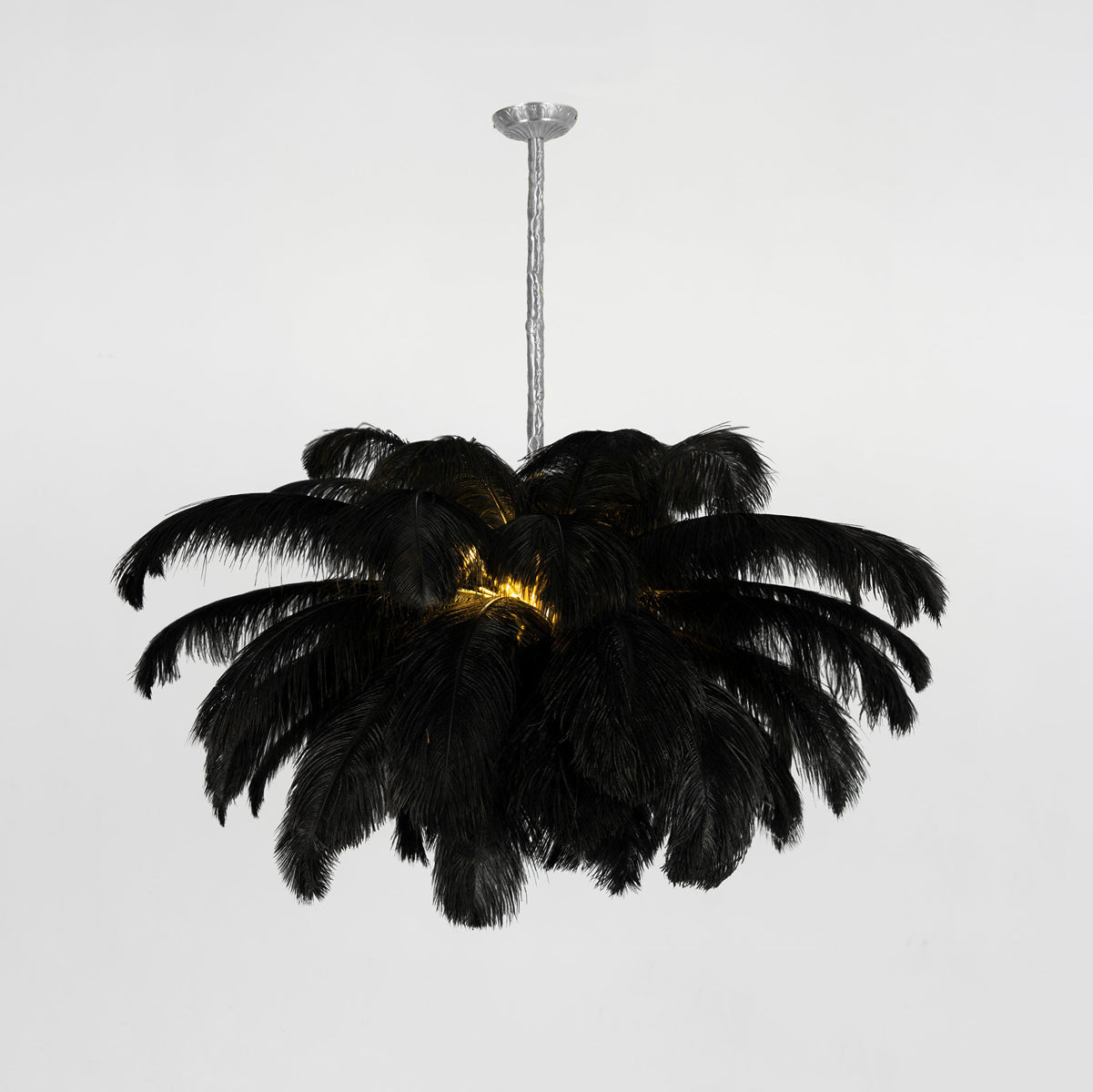 Ostrich feather chandelier shown from below with radiating plumes