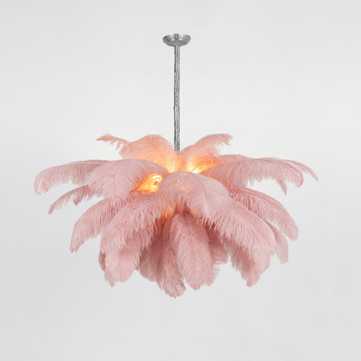 Ostrich feather chandelier styled in a refined dining space