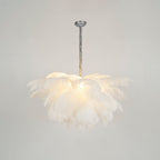 Ostrich feather chandelier glowing above an elegant interior