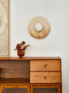 A ridged terra-beige ceramic ring from a Clérachic wall sconce, shown here with its centre open and no glass globe fitted.