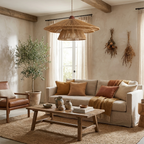 An olive tree in a terracotta pot stands beneath this Clérachic pendant's warm glow in a beamed living room.