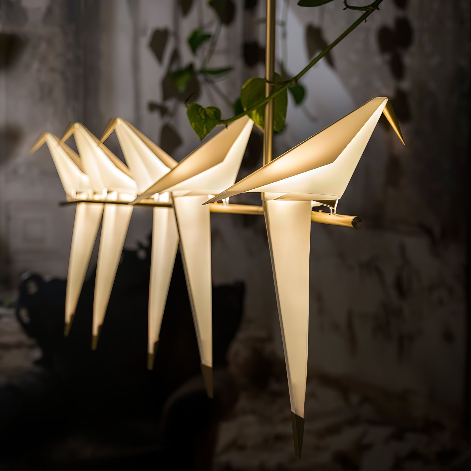 Bird chandelier with multiple acrylic birds on a gold branch