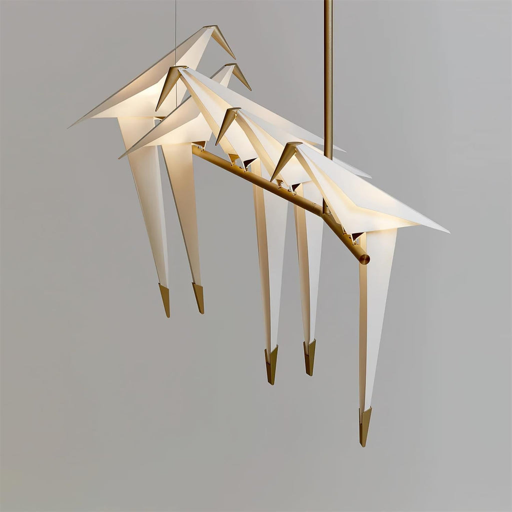Bird chandelier with perched birds glowing in warm white