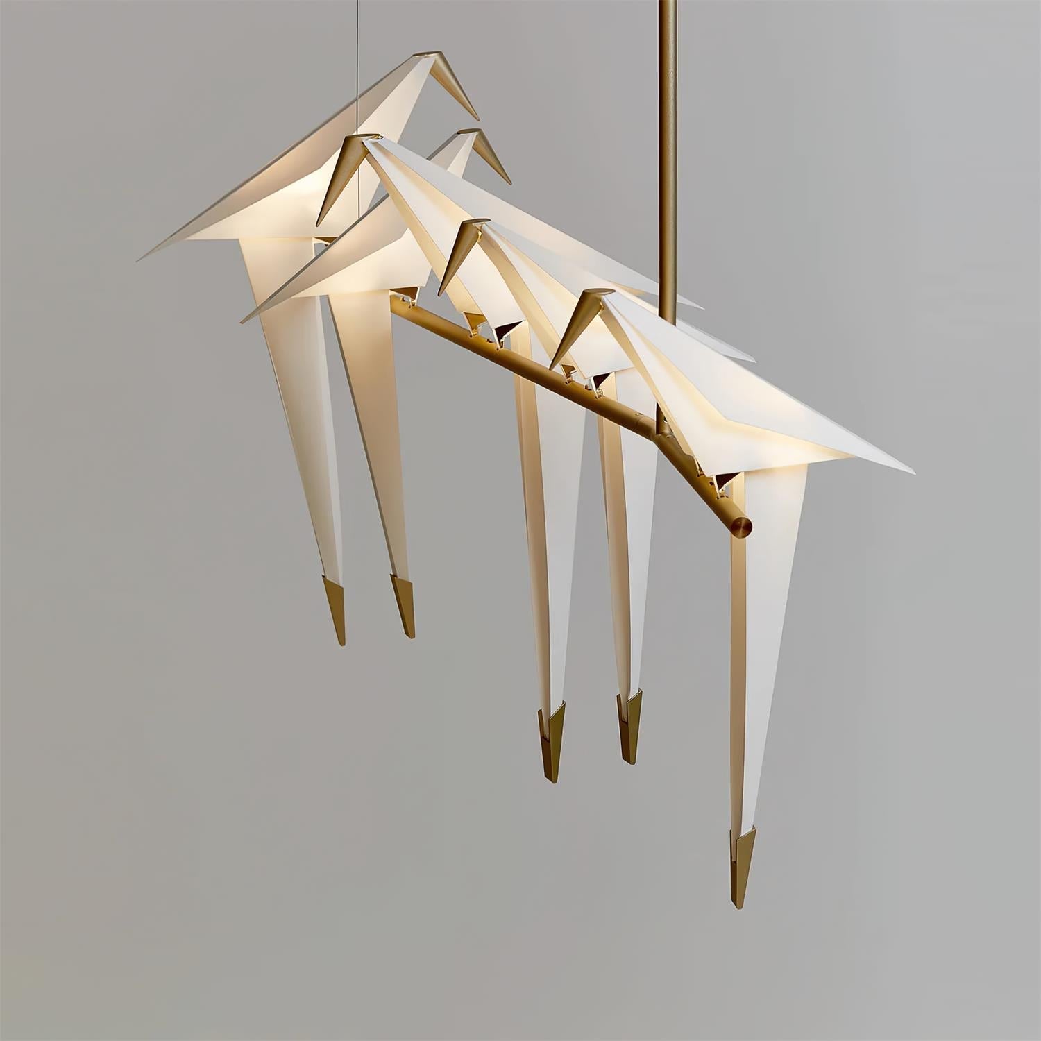Bird chandelier with perched birds glowing in warm white