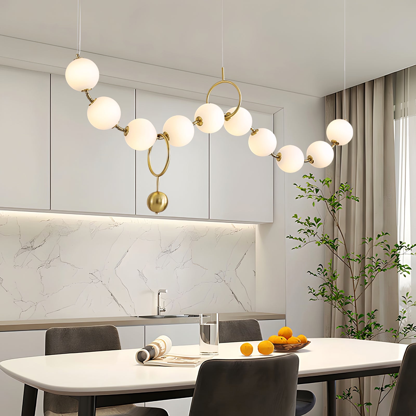 Necklace pendant light glowing softly over a table