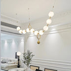Hand-blown glass globe detail on the necklace pendant light
