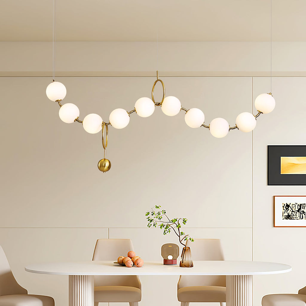 Necklace pendant light with pearl-like glass globes lit