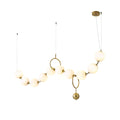 Necklace pendant light with white glass globes glowing warm