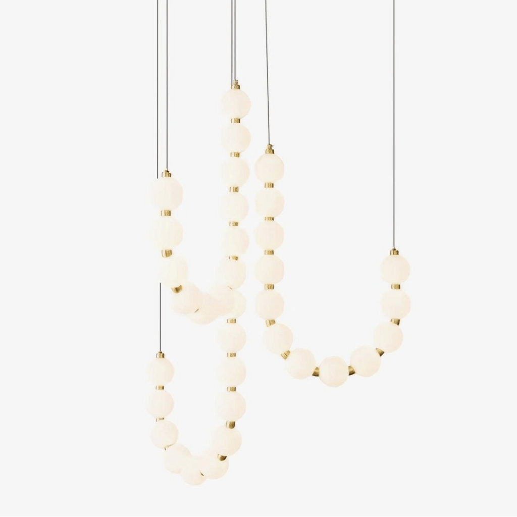 Acrylic pearl chandelier styled above an elegant table setting