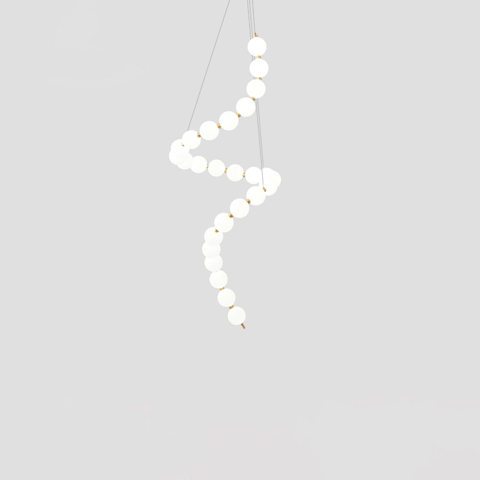 Acrylic pearl chandelier with luminous orbs in a styled room