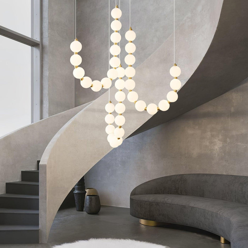 Acrylic pearl chandelier with luminous orbs in a refined space