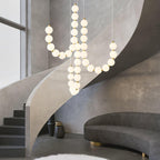 Acrylic pearl chandelier with luminous orbs in a refined space