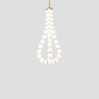 Acrylic pearl chandelier suspended above a modern interior