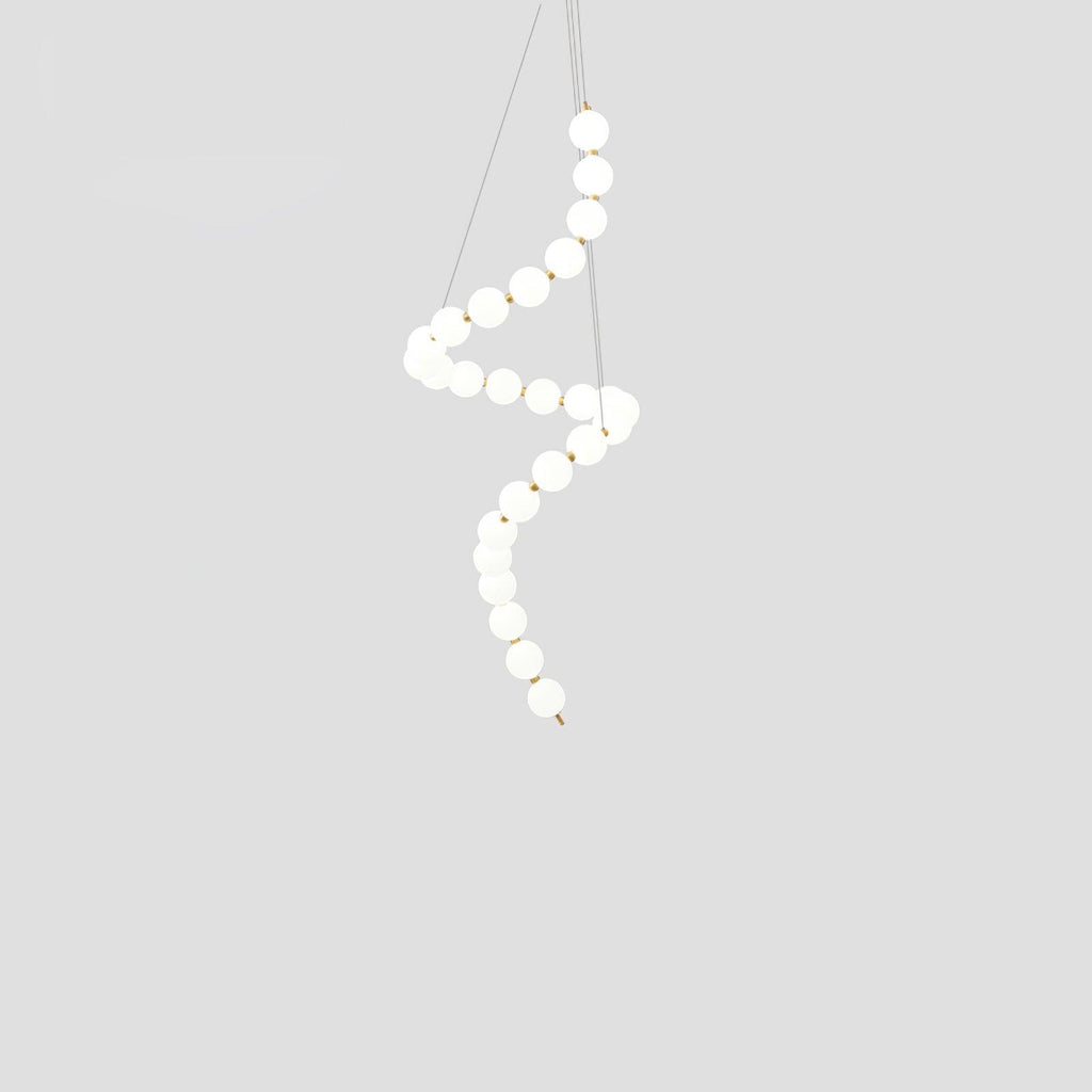 Acrylic pearl chandelier detail of clustered glowing white orbs
