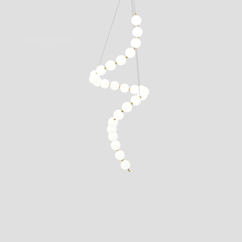 Acrylic pearl chandelier as a warm glowing dining centrepiece