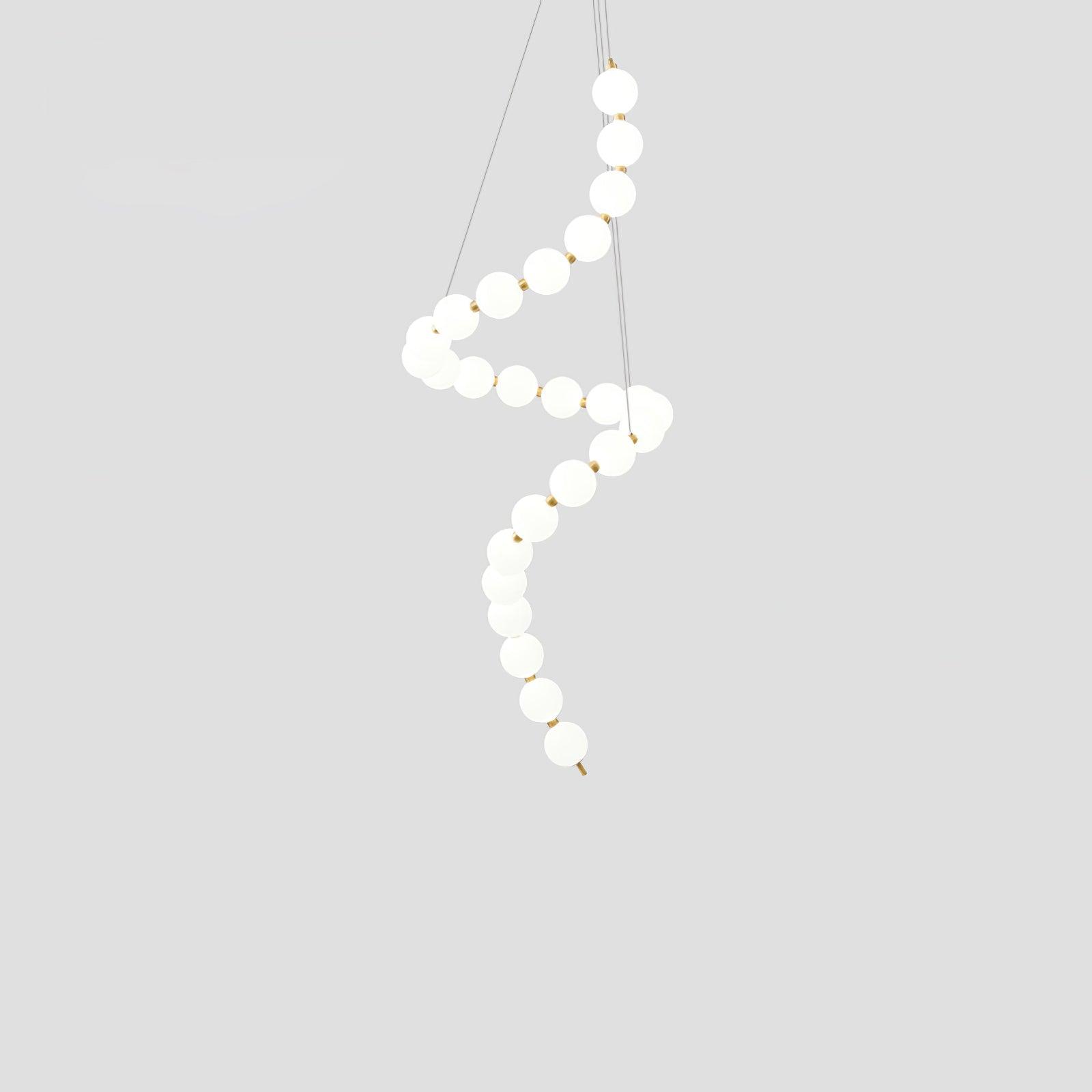 Acrylic pearl chandelier as a warm glowing dining centrepiece