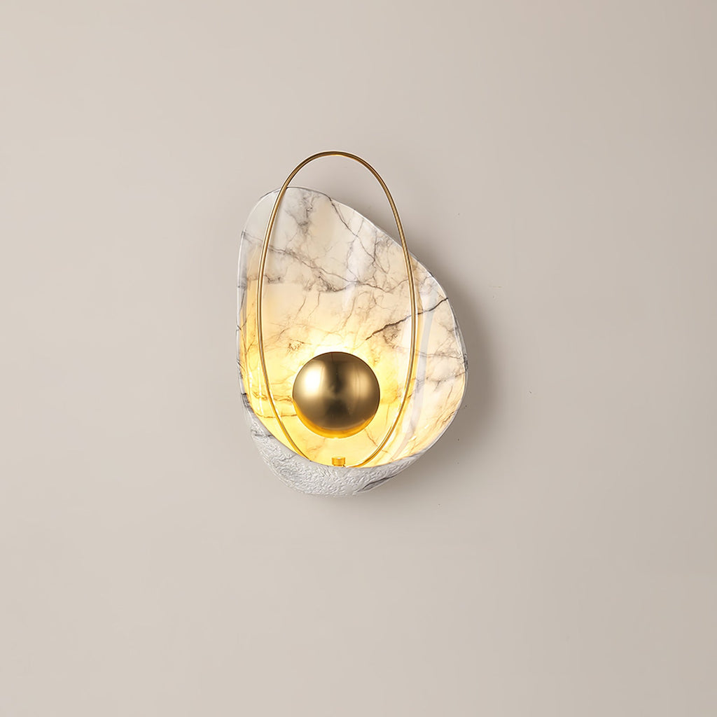 The whole lit sconce small in frame on a plain beige wall, with bare wall on every side.