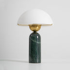 Green marble Veviniel lamp on a white background, seen from above with the socket under the shade.