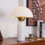 Low-angle view of the Veviniel lamp showing the underside of the shade and its brass bowl fitting.