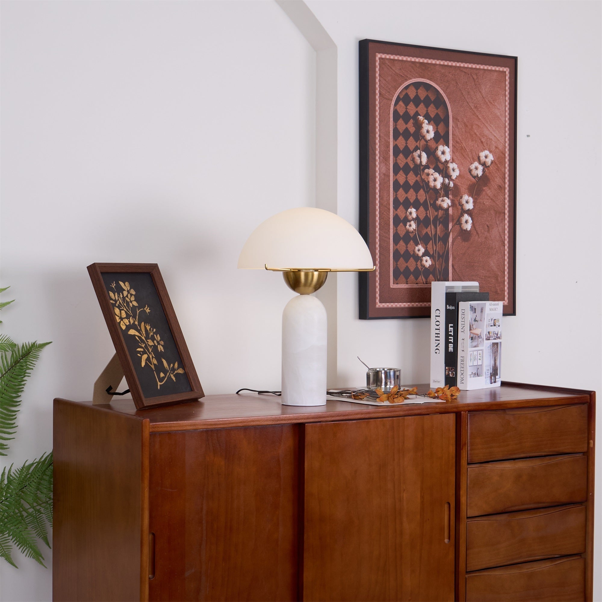 Veviniel lamp photographed close, the brass bowl and gold shade rim visible beneath the dome.