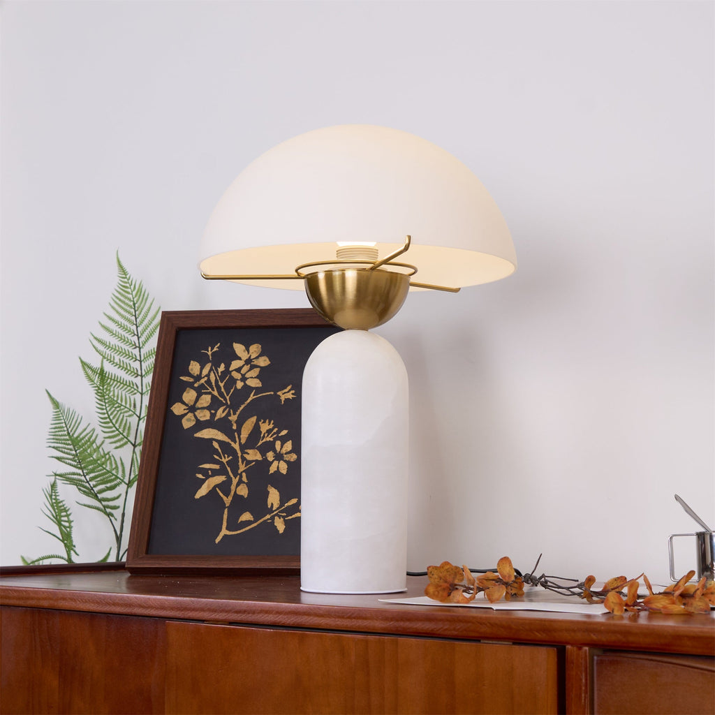 Veviniel lamp viewed from above on a sideboard, the empty bulb socket visible inside the shade.