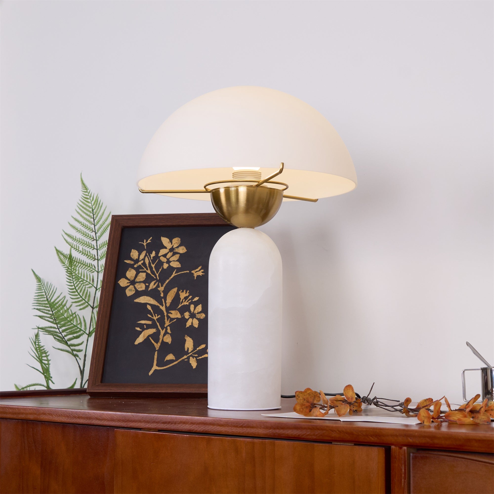 Veviniel lamp viewed from above on a sideboard, the empty bulb socket visible inside the shade.
