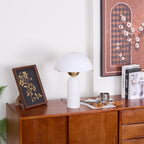 Veviniel lamp on a mid-century sideboard beneath a framed print, shown in a full room composition.