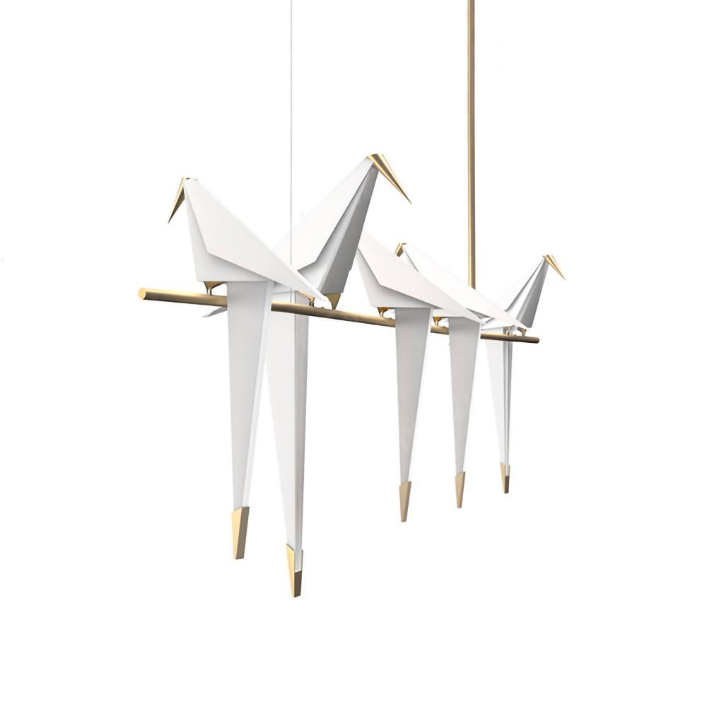Bird chandelier suspended over a table with warm glow