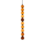 Photographed on white, this Clérachic pendant's alabaster spheres shift from amber to brown.