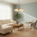 Sunlight strikes a powder-blue wall behind this Clérachic chandelier, hung above a cream sofa and coffee table.