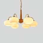 Six cream shades on this Clérachic chandelier are shown fully lit against a plain grey background.