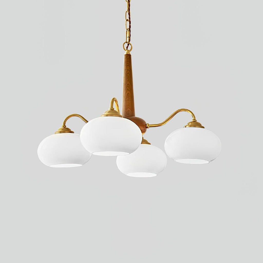Four white glass shades on this Clérachic chandelier are shown against a plain grey backdrop.