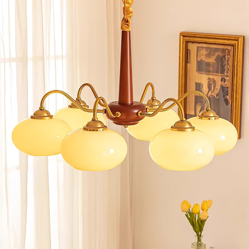 Yellow tulips sit below this Clérachic chandelier, its cord-wrapped canopy visible near the ceiling.