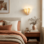 Petalia wall sconce mounted in a calm styled hallway