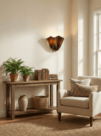 Petalia wall sconce casting a soft glow in a bedroom setting