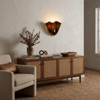 Petalia wall sconce translucent glass glowing in low light