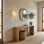 Alabaster wall lamp with gold finish glowing in interior
