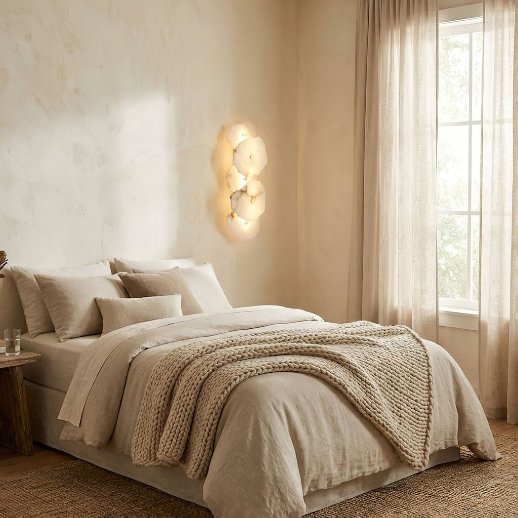 Genuine alabaster wall sconce with gold finish lit softly
