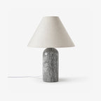 Clérachic lamp in a grey marble finish, shown unlit against a plain white backdrop with its cord visible.